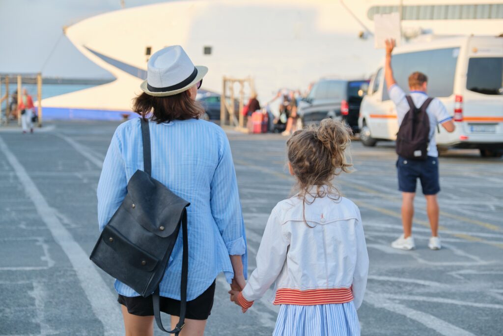 Sea port, traveling family mother and little daughter